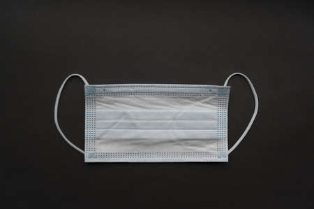 Medical mask isolated on background. Close-up of Coronavirus or COVID-19 protective face mask....