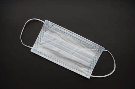 Medical mask isolated on background. Close-up of virus   protective face mask. Workwear prevents...