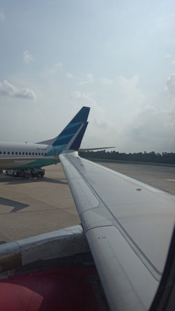 View from the window of a passenger plane at the airport in Bangkok, Thailandの写真素材