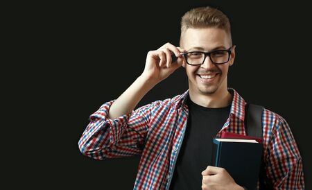 Delighted male student portraitの写真素材
