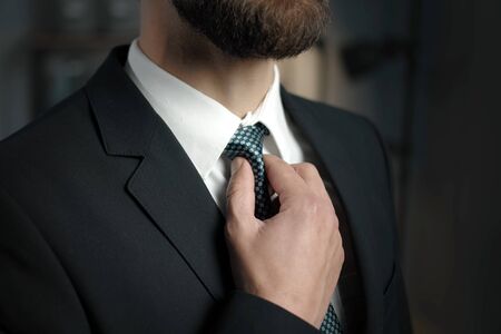 Tie adjusting closeup