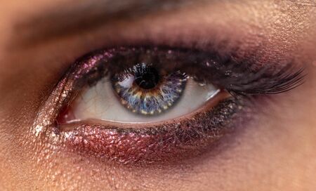 Macro of female eye with bright make-up