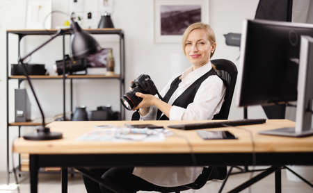 Photographer sitting at office