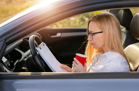 Woman working in carの写真素材