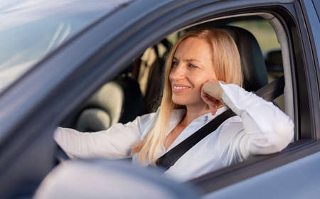 Female driver inside modern car
