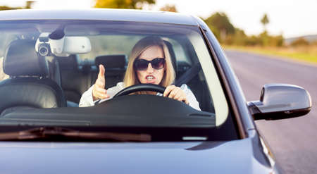 Angry female driver in auto