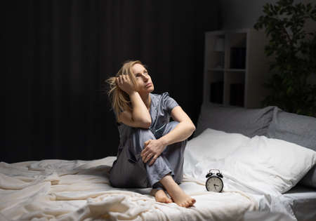 Woman with insomnia at nightの写真素材