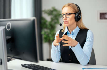 Woman having video call at homeの写真素材