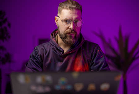 Man with laptop at home