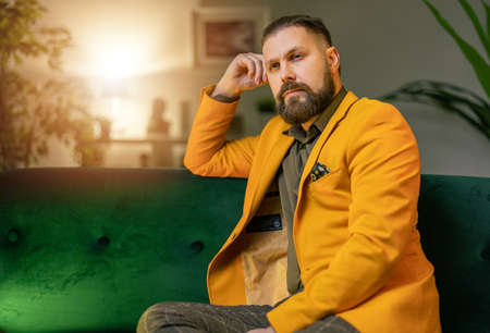 Pensive man on couchの写真素材