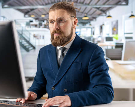 Businessman using pc at office