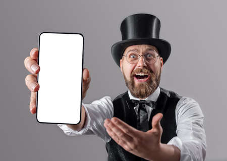 Retro man holding white screen mobileの写真素材