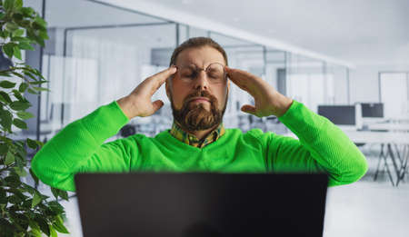 Tired man at office