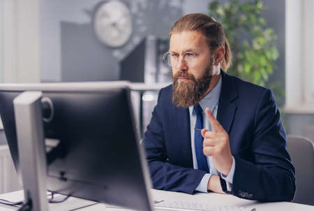 Focused man with pc at office