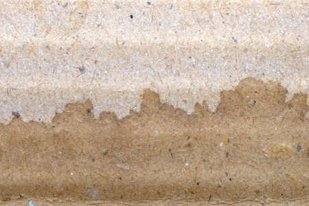 dry and wet  brown corrugate cardboard texture backgroundの写真素材