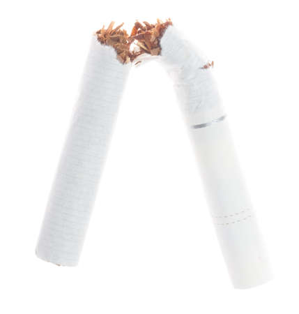 Broken cigarette isolated on white backgroundの写真素材