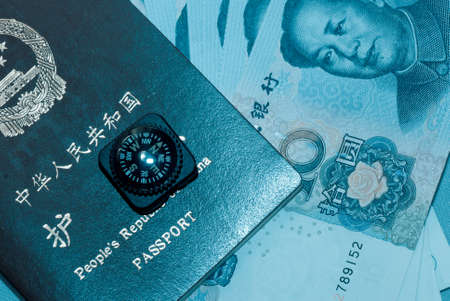 Chinese passport bank note and compassの写真素材