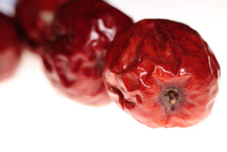 red jujube isolated on whiteの写真素材