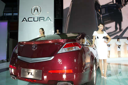 GUANGZHOU, CHINA - DEC 27: Fashion Model on car at the 8th China international automobile exhibition on December 27, 2010 in Guangzhou China.のeditorial素材