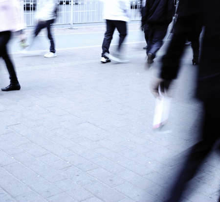Busy big city people walk on street at blur motionの写真素材