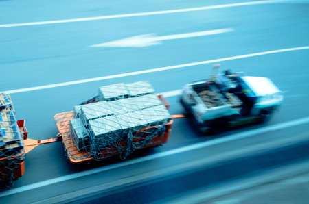 cargo car delivery on airport blur motionの写真素材