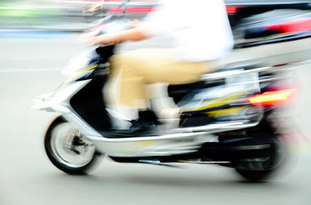 big city motor bicycle driver blur motion