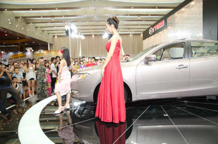 GUANGZHOU, CHINA - OCT 02: Fashion model at the Guangzhou daily Baiyun international automobile exhibition. on October 02, 2011 in Guangzhou China.のeditorial素材