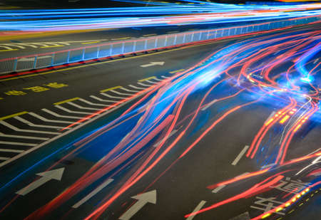 busy big city traffic trail night cityscape at Guangzhou Chinaの写真素材