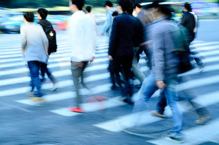 busy city people crowd on zebra crossing streetの写真素材