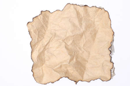 paper with burned edges texture backgound isolated on whiteの写真素材