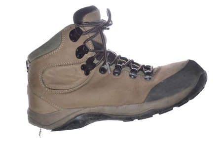 old hiking shoe isolated on whiteの写真素材