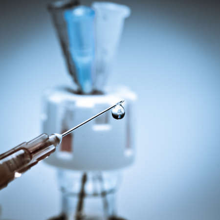 medical syringe squirting fluid isolatedの写真素材