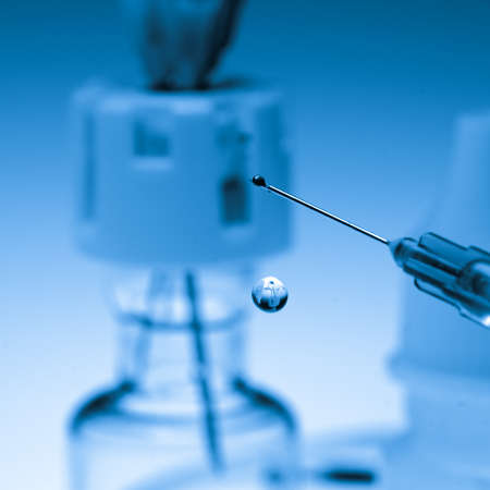 medical syringe squirting fluid isolatedの写真素材