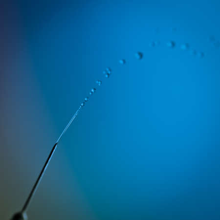 medical syringe squirting fluid isolatedの写真素材
