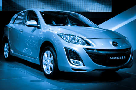 GUANGZHOU, CHINA - Nov 26:  mazada 3 car on display at the 9th China international automobile exhibition. on November 26, 2011 in Guangzhou China.のeditorial素材