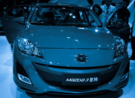 GUANGZHOU, CHINA - Nov 26:  mazada 3 car on display at the 9th China international automobile exhibition. on November 26, 2011 in Guangzhou China.のeditorial素材