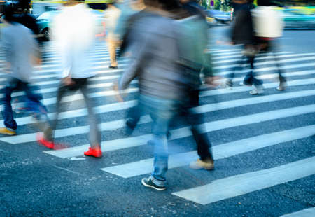 busy city people crowd on zebra crossing streetの写真素材