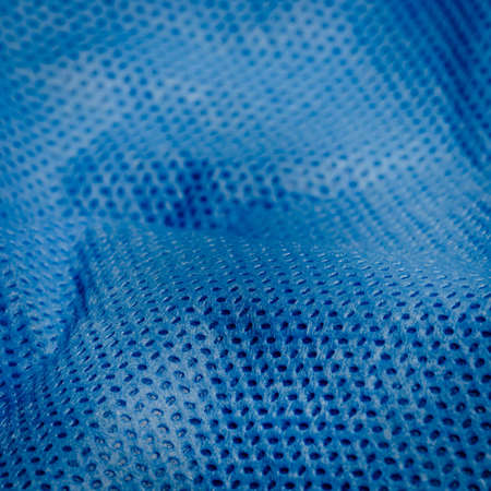 blue nonwoven fabric cloth texture backgroundの写真素材