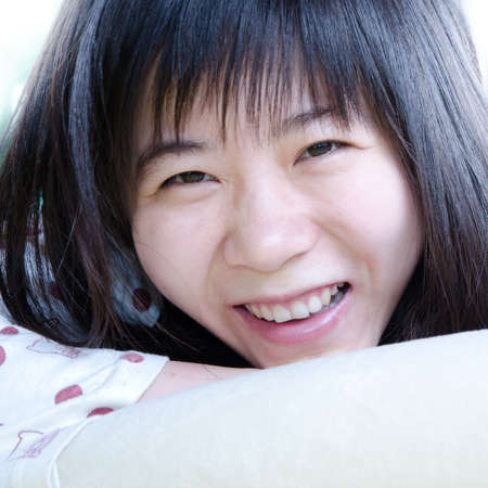 asian women smile portrait on bedの写真素材