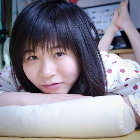 asian women smile portrait on bedの写真素材