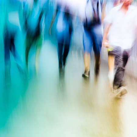 big city people walk on road in rainy day, blured motion abstract background.の写真素材