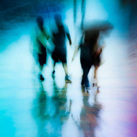 big city people walk on road in rainy day, blured motion abstract background.