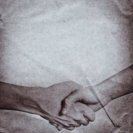 business hand shaking concept, on grunge paper background