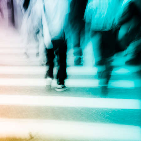 people walking on big city street, blurred motion zebra crossing abstract