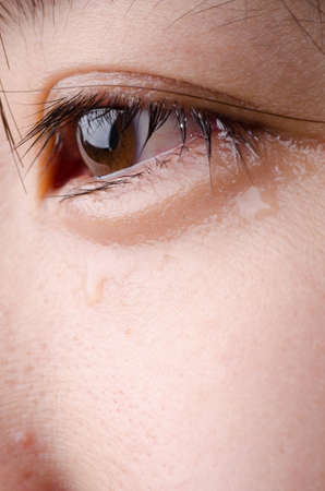 eye with tear of asian womanの写真素材
