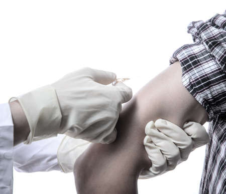 nurse injecting vaccination with patientの写真素材