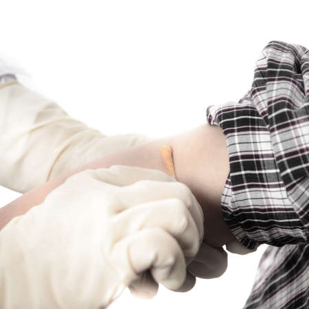 nurse injecting vaccination with patientの写真素材