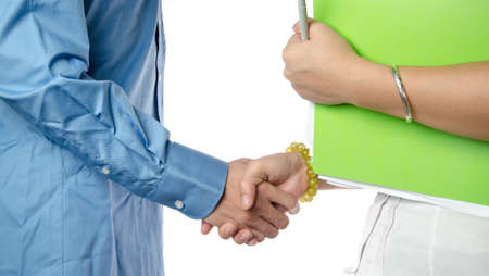 business man and woman shaking handsの写真素材