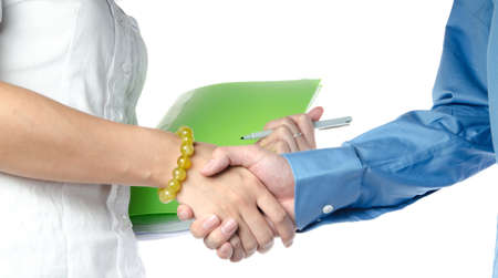 business man and woman shaking handsの写真素材