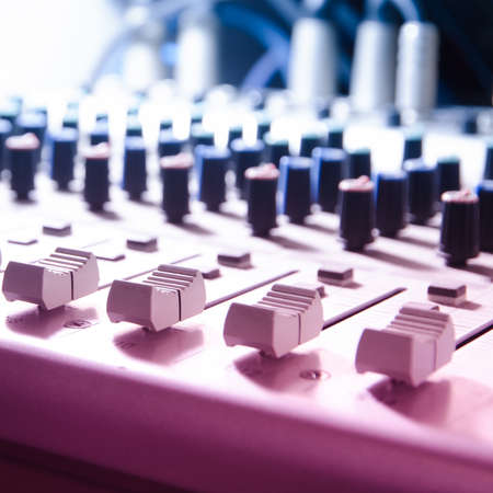 sound studio adjusting record equipment